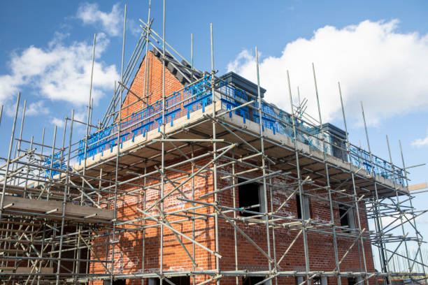 istock A new house under construction and surrounded in scaffolding 2176130361