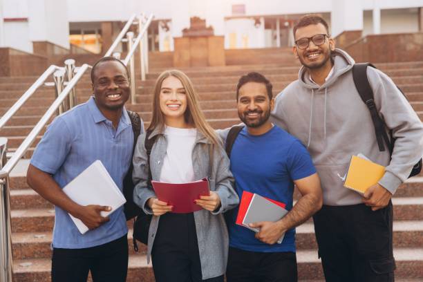 istock Diverse Group of College Students Smiling Together with Notebooks Outdoors on Campus Steps 2176130430