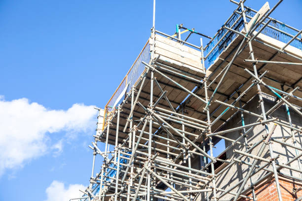 istock New houses under construction and surrounded in scaffolding 2176130709