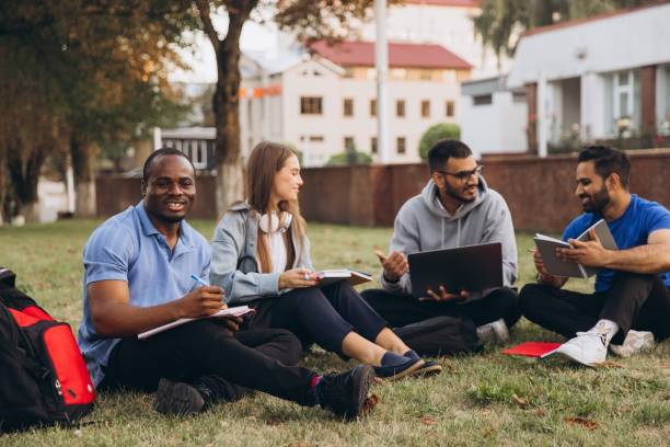 istock Diverse Group of College Students Studying Together Outdoors on Campus Lawn 2176131246