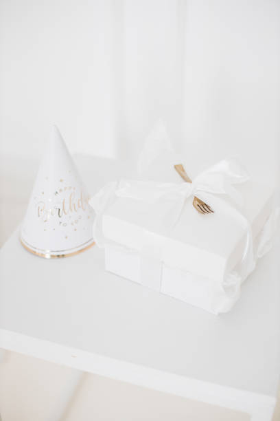 istock Elegant birthday celebration setup with gift and party hat 2176132924