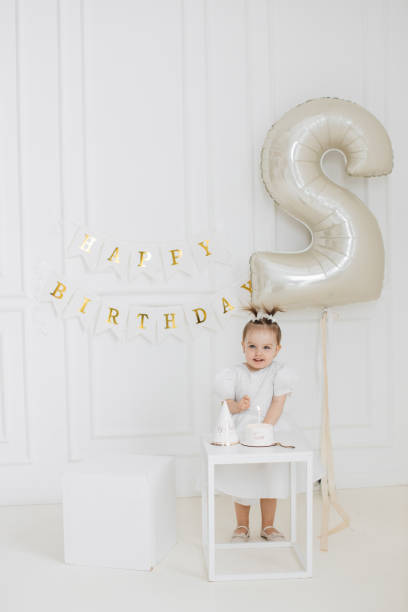 istock Joyful birthday celebration with toddler and balloons 2176132938