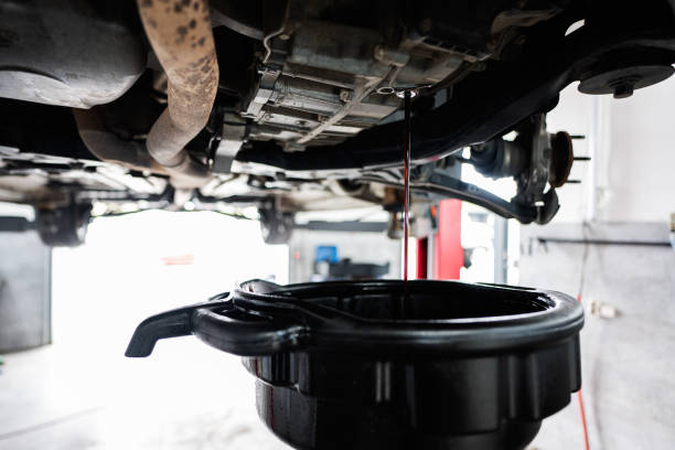 Oil change process in a car repair garage