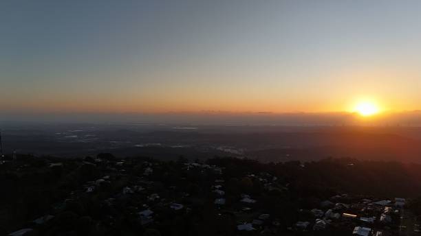 istock Sunset over hills and city skyline 2176142447