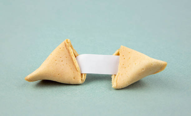 istock Opened fortune cookie with a empty piece of paper inside, a 