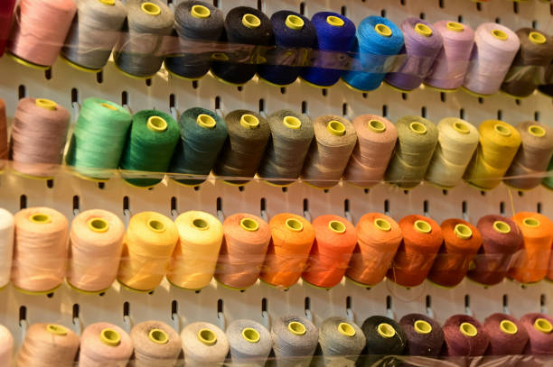 Close up view of a set of sewing threads. Multi-colored thread. For background use.