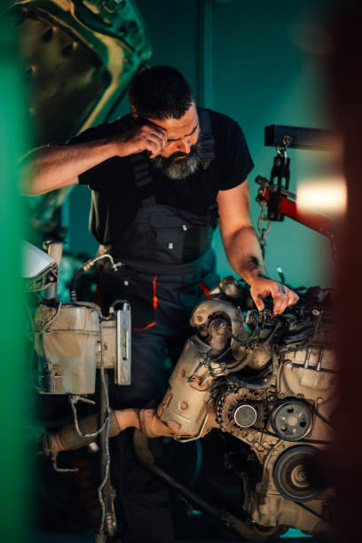 istock Mechanical work involved in the intricate repair of a car engine 2176149708