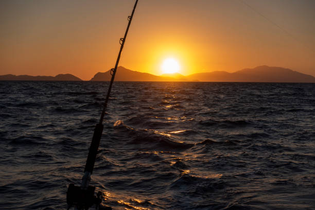 Father and son going to fish together with all needed equipment.