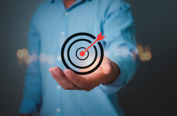 istock Man hold virtual target icons for business objective, Targeting business concept, Strategic planning for business growth and target customer group, Set up business objective target goal. 2176152511