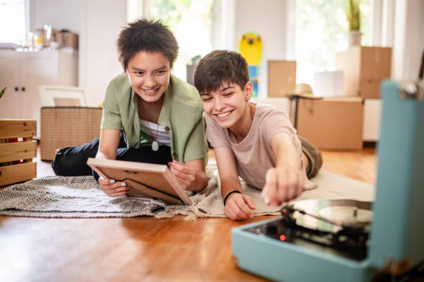 istock Two young friends enjoying time and music together. 2176158828