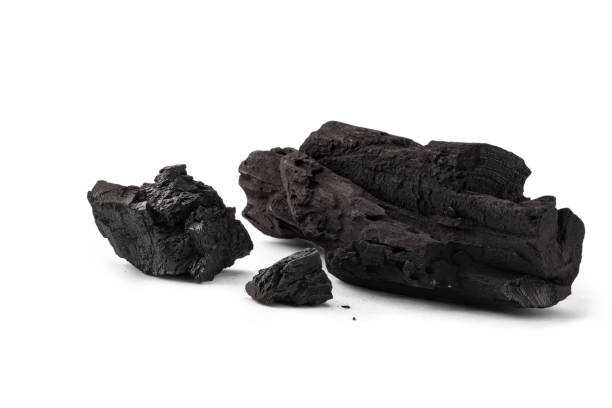 Natural wood charcoal, traditional charcoal or non smoke and odourless charcoal hard wood charcoal isolated on white background.  Studio shot.