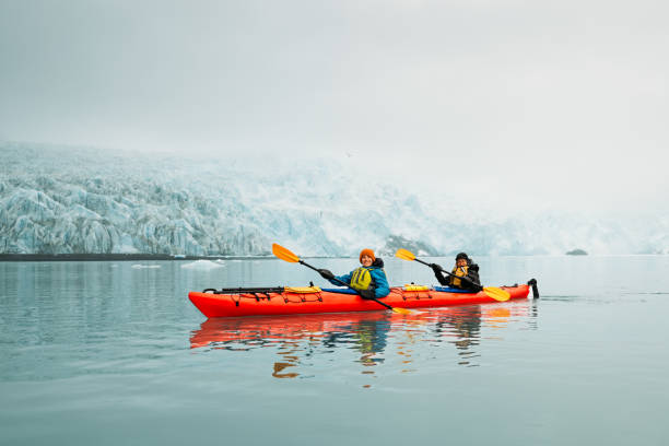 Mother and son Kayaking to Aialik glacier in Alaska