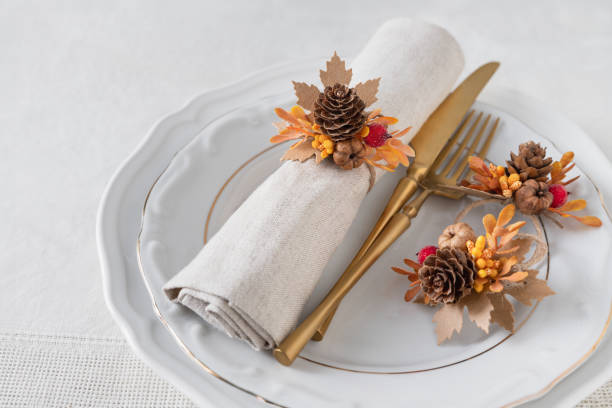 istock Pine cones and pumpkins fall place setting decoration on plate 2176170608