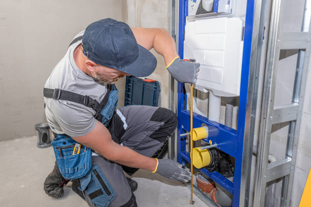 istock Plumber does measures the correct height above the ground with a tape measure. 2176173634