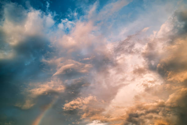 istock Dramatic sky with cloud and rainbow in the sunset 2176175223