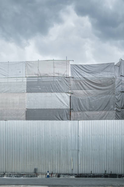 istock Construction site building with scaffold and closed fence for safety 2176175279