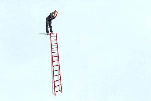 istock Woman Looking Down At  Ladder 2176177351