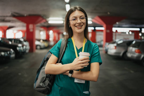 istock Healthcare worker holds coffee in structured garage 2176179978