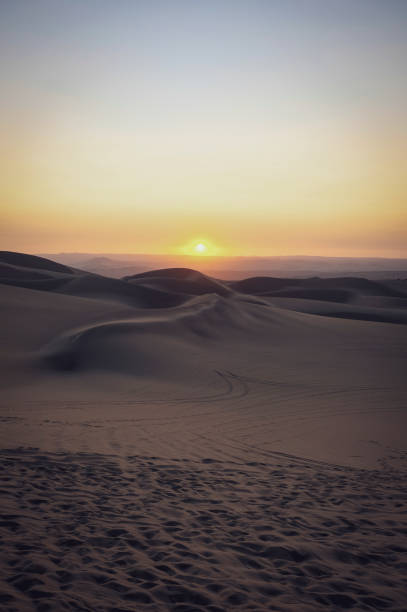 istock Sand dunes in Huacachina at sunset 2176180596