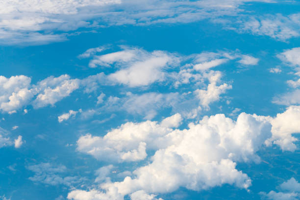 istock Clouds at the sky. Cloudscape - Blue sky and white clouds. Beautiful blue sky background with clouds. White fluffy clouds in the blue sky. Blue sky and white clouds of daytime 2176187428