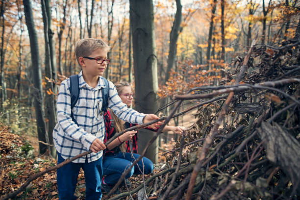 istock Children building a forest shelter from sticks 2176192882
