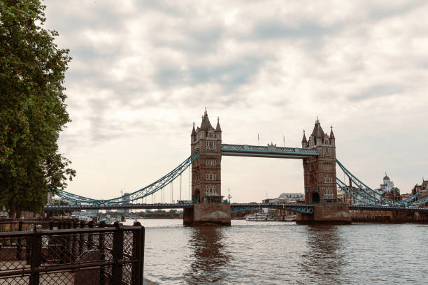 Tower Bridge crossing Thames River in London.