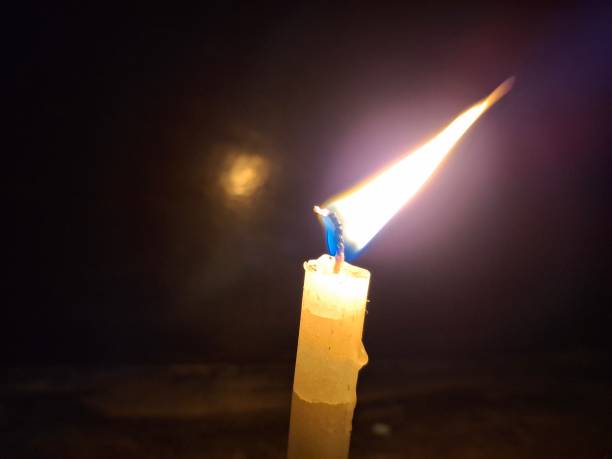 istock Candle light : A candle is a wax cylinder with a wick, providing light when burned, often scented. 2176195809