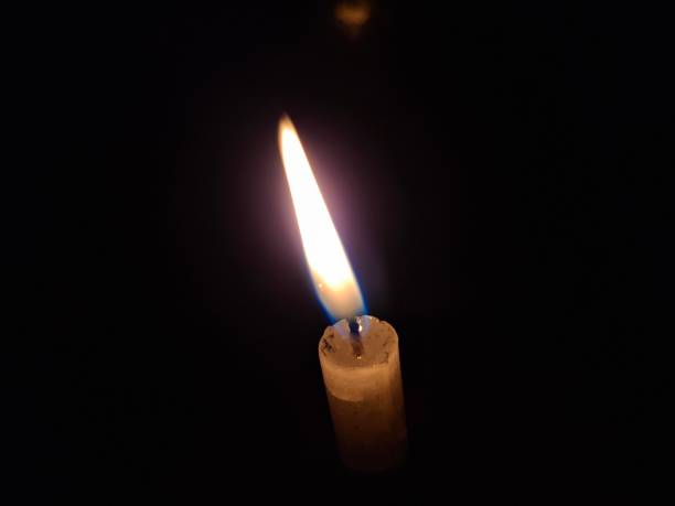 istock Candle light : A candle is a wax cylinder with a wick, providing light when burned, often scented. 2176195853