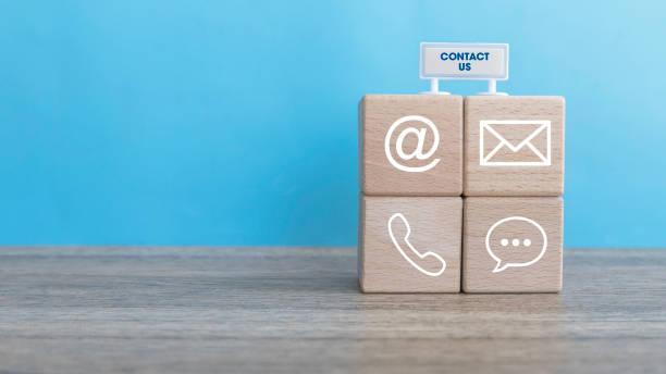 istock Connectivity Essentials: Wooden Cube Featuring Email, Phone, Message, and Mail Symbols 2176196483