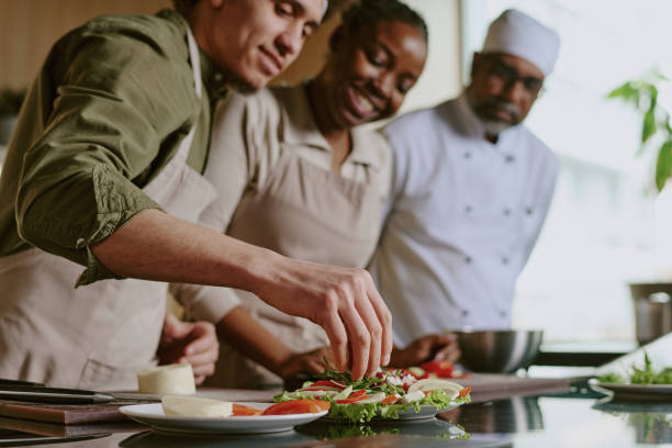 istock Male Sous chef Adding Condiment into Dish 2176196951