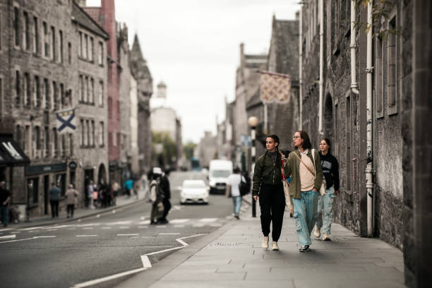 istock Three woman walking together the Royal Mile in Edimburgh 2176198101