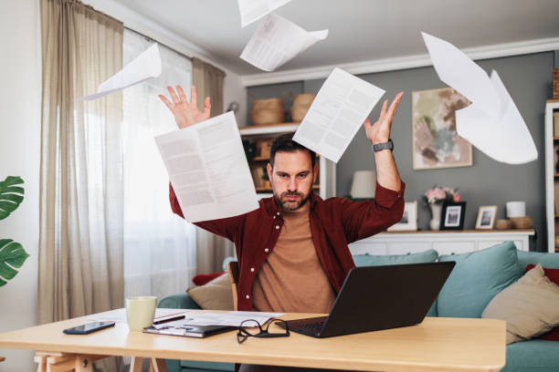 Frustrated and angry businessman working late at his office