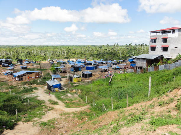 istock Child walking through makeshift village in developing country 2176203618