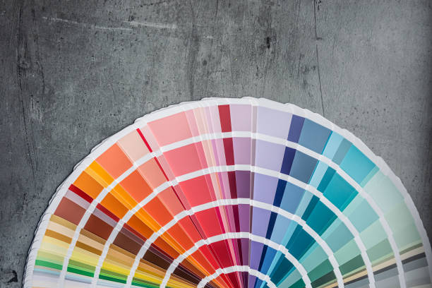 istock Rainbow catalog of paints with a various color palette on grey desk 2176206082