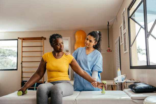 istock Elderly woman doing physical therapy with dumbbells 2176208470