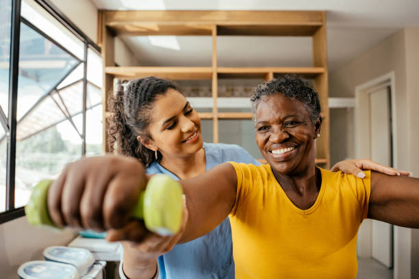 istock Elderly woman doing physical therapy with dumbbells 2176208563