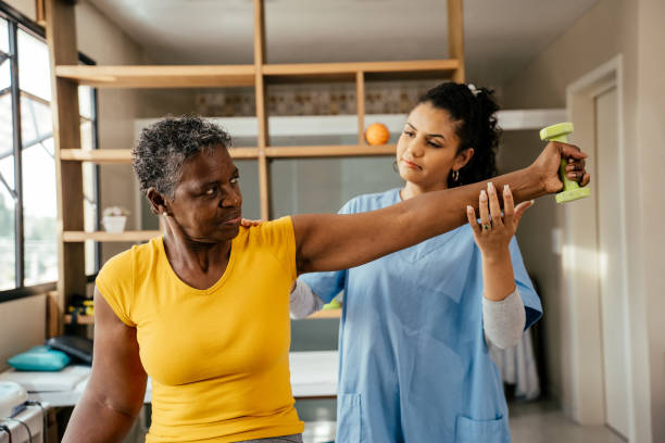 istock Elderly woman doing physical therapy with dumbbells 2176208582
