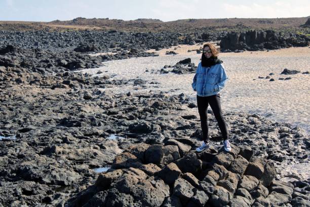 istock Person on a Rocky Landscape with a Remote Background 2176209952