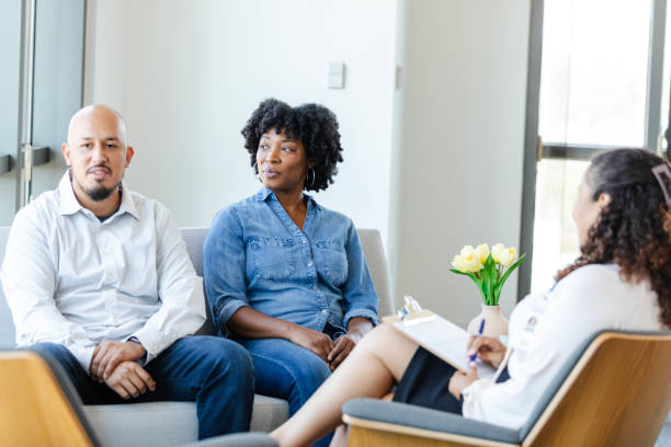 istock Woman looks at husband during counseling session 2176214569