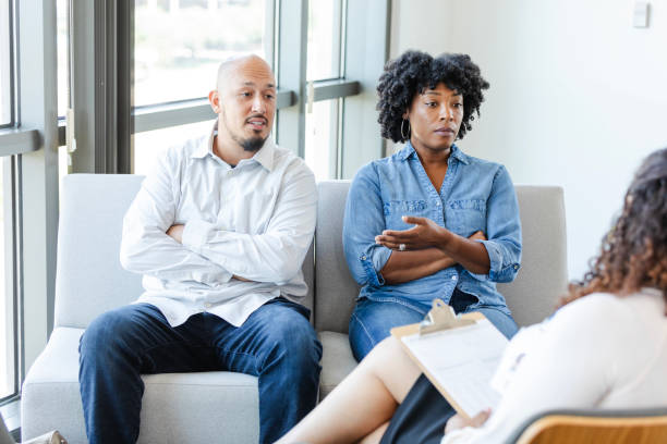 istock Diverse married couple meets with female therapist 2176214586