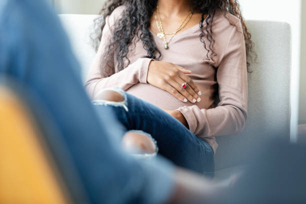 Low angle view with focus on pregnant young woman