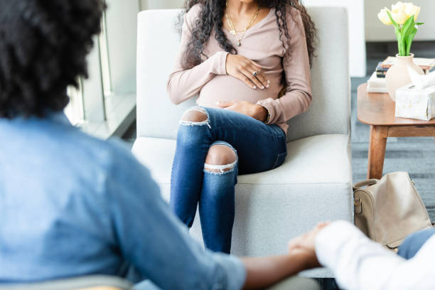 istock Unrecognizable diverse couple talks to unrecognizable gestational surrogate 2176214600