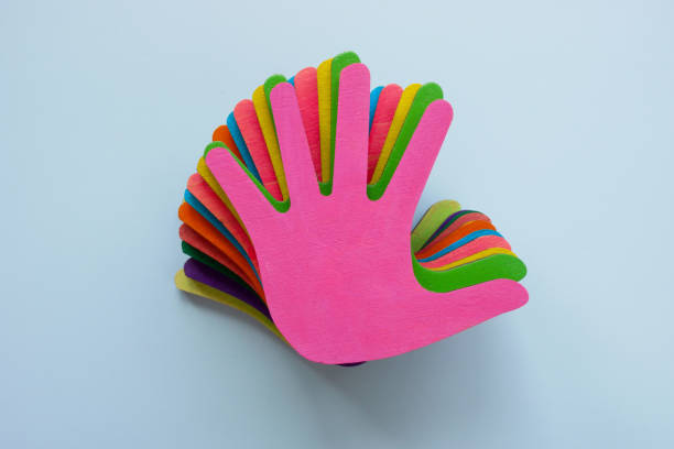 Inflated rubber gloves covered in water droplets forms an abstract artistic design. The image conveys creativity, uniqueness and texture through its intricate arrangement and reflective surfaces