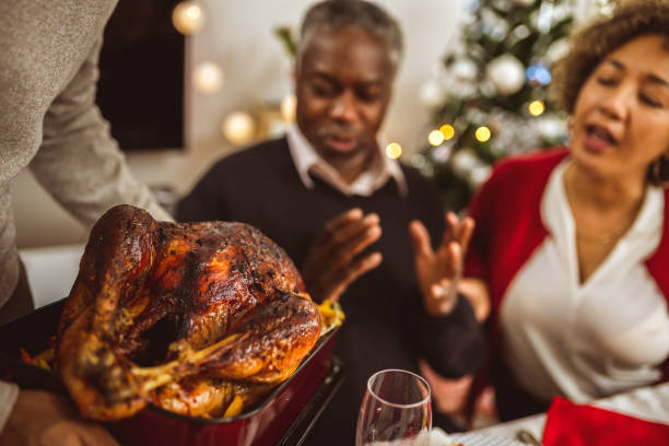 istock Turkey is being served on the dining table on Thanksgiving dinner. 2176220648