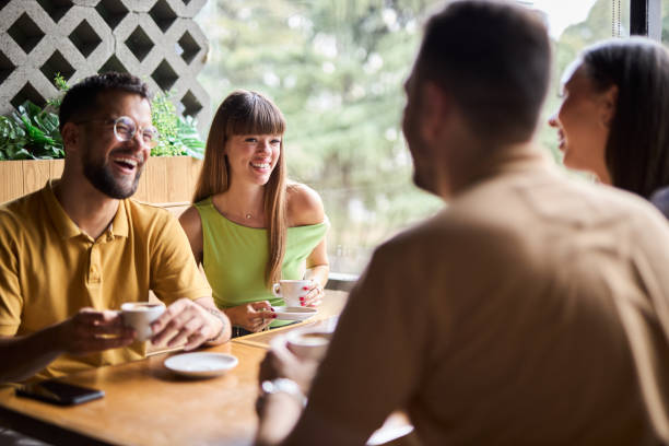 istock Group of happy friends talking while enjoying in a cafe. 2176221609
