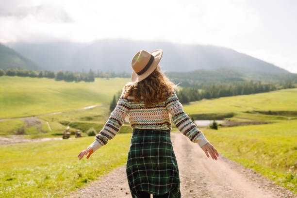 istock Carefree woman basks in nature's beauty. 2176227456