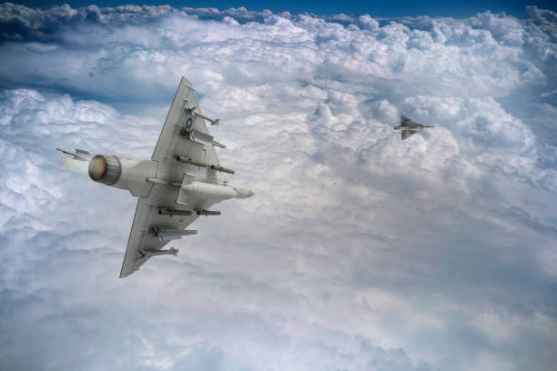 istock Jet aircrafts flying over the clouds. 2176227516