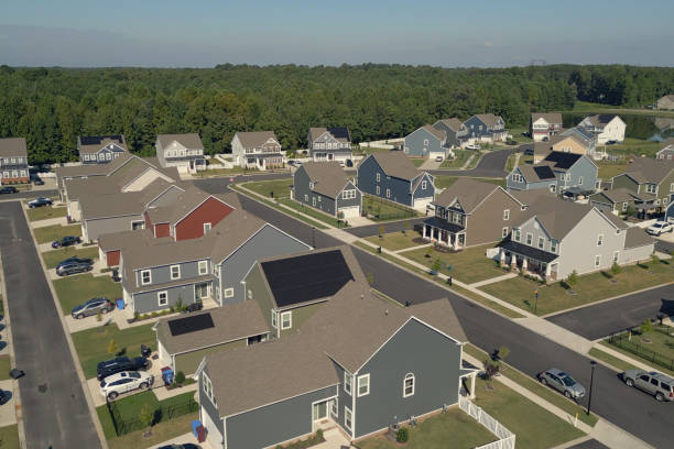 istock Green House with Solar Panels  - Modern Middle Class Neighborhood - Dense Population - Wide Angle 2176227995
