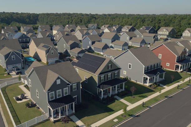 istock Green House with Solar Panels -  Modern Middle Class Neighborhood - Dense Population - Wide Angle 2176228062