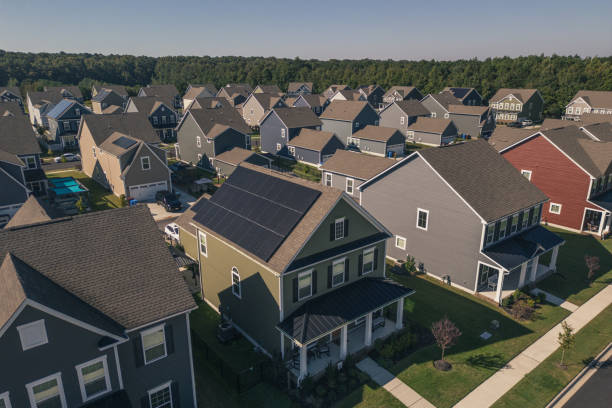 istock Green House with Solar Panels - Modern Middle Class Neighborhood - Dense Population - Close Up 2176228148